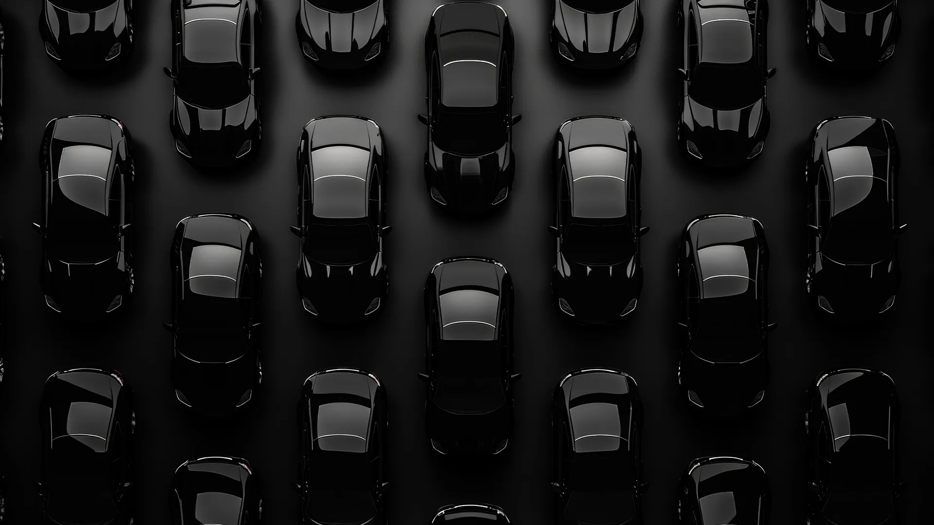 Overhead view of sleek black cars representing premium wheel coating and franchise branding for Wheel Color It